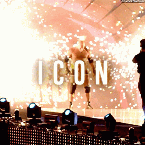 the words icon displayed over two people walking on stage