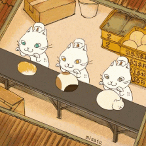 there are three cats sitting at a table with one cat on it