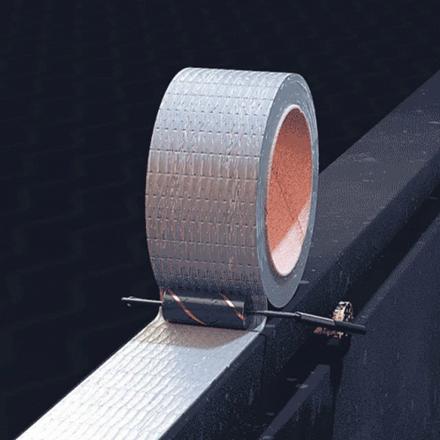 a roll of duct tape over a conveyor belt