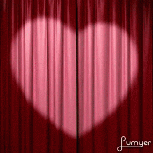 a purple curtain with a white heart on it