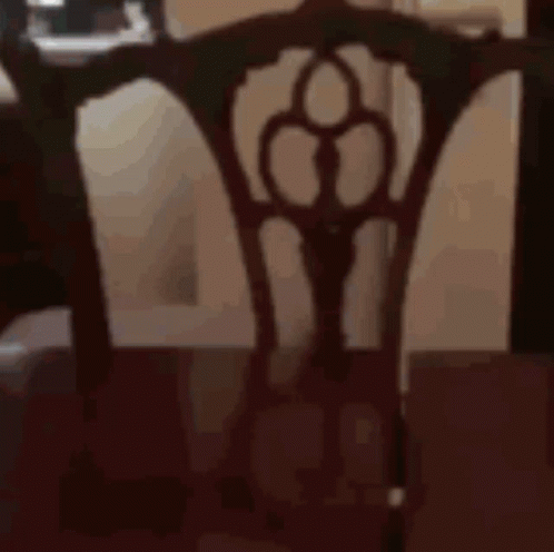 the back of the chair has an intricate design on it