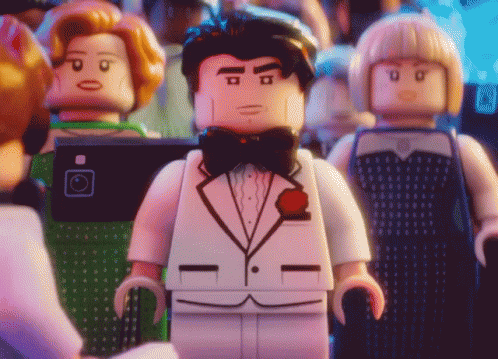 a row of legos wearing suits and bow ties