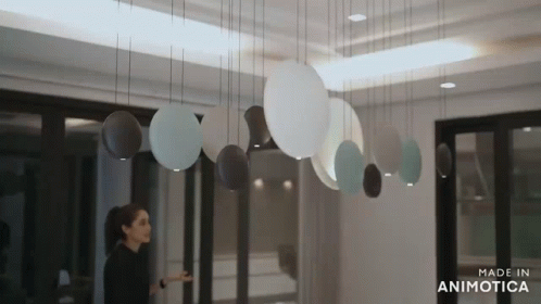 a group of plates are hanging from the ceiling