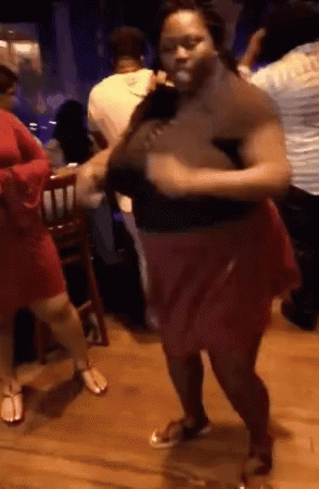 two people are dancing at a party