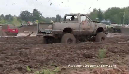 there is a truck that is in the mud