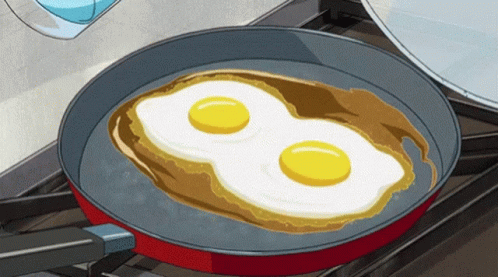 two fried eggs are cooking in a set