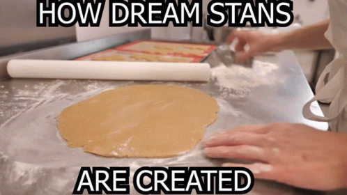 a person making bread with dough on a paper towel