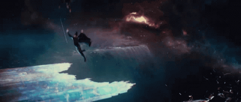 a man falling off a boat into a very dark ocean