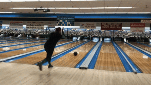 a bowling alley is lined with blue lanes