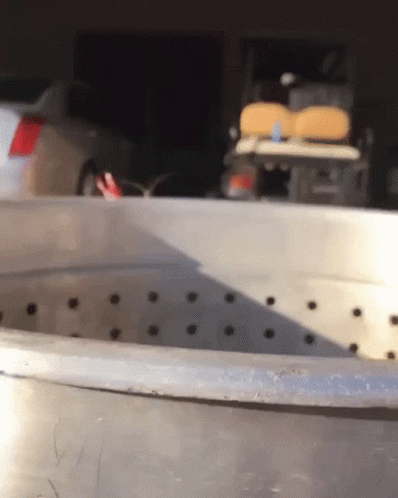 an empty metal bucket in a factory