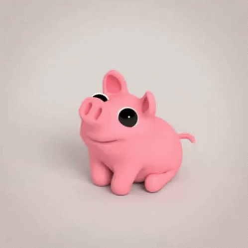 a toy pig is sitting in front of a white background