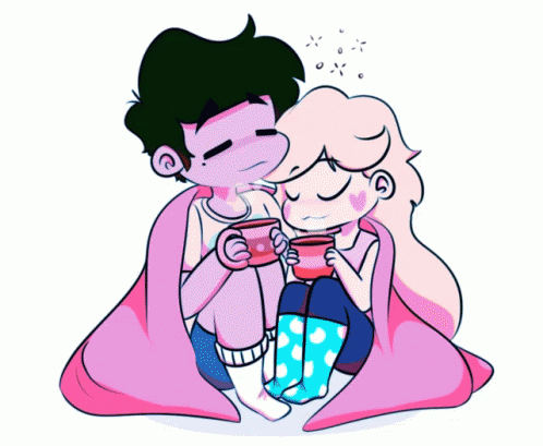 a couple under a blanket one holding onto the other
