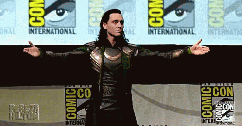 loki in his costume and cape for a press