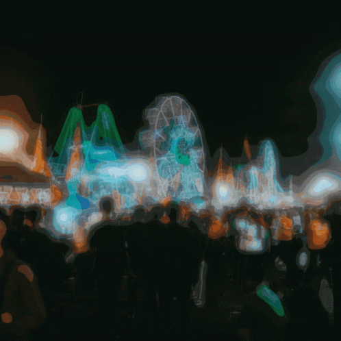 blurry pograph of a carnival ride at night