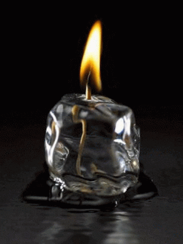 a flame that is burning inside of a glass bottle