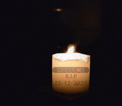 a lit candle with the letters months printed on it