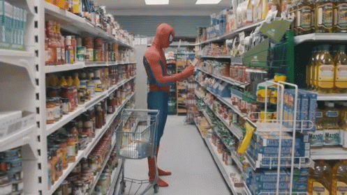 a guy dressed as aliens in a grocery aisle