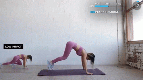 a woman doing the splits on her mat