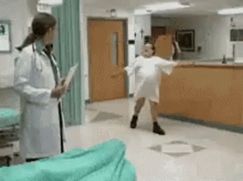 two doctors in a hospital are dancing