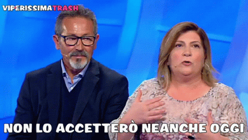 a woman wearing glasses with her arms folded in a front view of the tv, the caption reads no lo acetto neanece neiche oggi