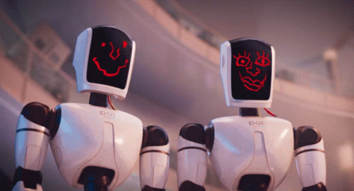three small robots are standing near one another