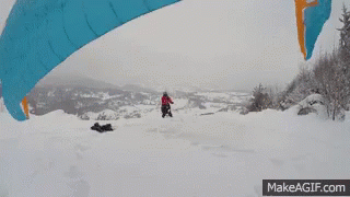 a snowboarder has his feet under a large yellow banana