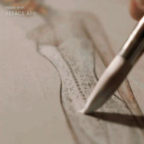 a close up of a pen and paper that has a drawing on it