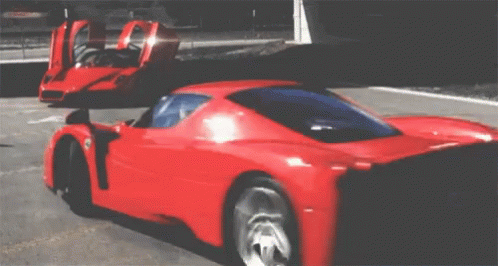 an exotic sports car is parked in a parking lot