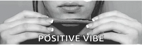 a person holding a cell phone in their hands with the text positive vibe above it