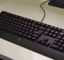 a computer keyboard is placed on top of a mouse