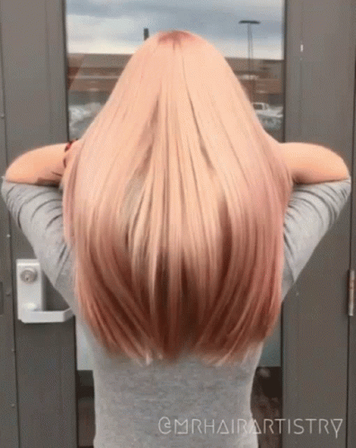 the back of a person's head with dyed blue hair