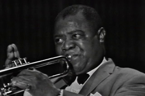 a close - up of a trumpet player with his mouth open