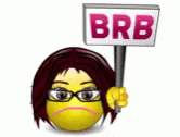 a woman holding a sign that says brb