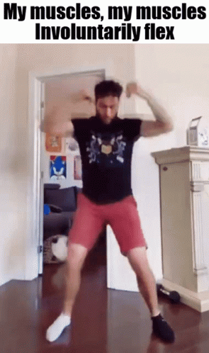 a man wearing purple shorts and t - shirt with no pants is dancing in a room