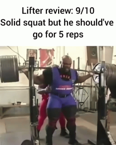 a man squats in front of a squat station