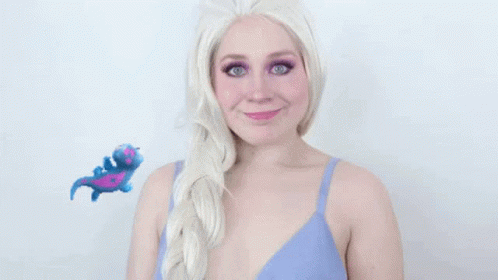 a person with blue makeup and white hair