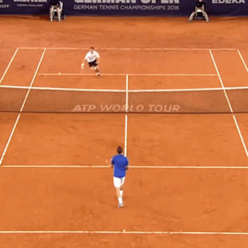 two tennis players playing a game on the court