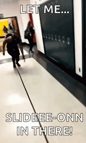 two people walking down an escalator with an ad underneath