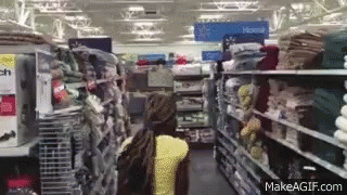 a po of some clothes in a store aisle