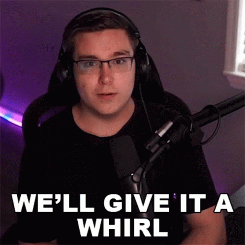 a person wearing headphones and in a mic, with the words well give it a whirl