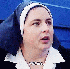 a woman in nun outfit holding a cell phone