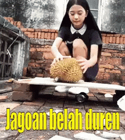 an image of girl kneeling down playing with ball