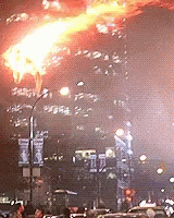 a large fireworks exploding out of a city at night