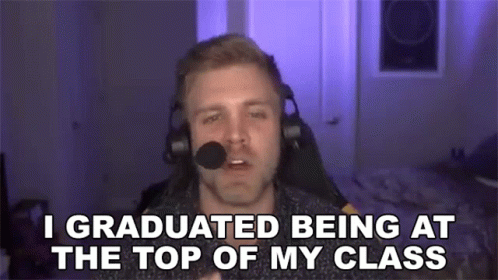 a man with headphones on with the caption i graduated being at the top of my class