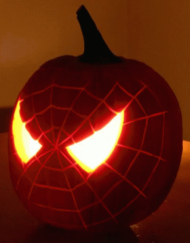a spiderman pumpkin sitting on a table
