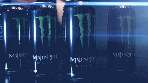monster energy drinks are sitting on the shelf