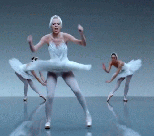 a group of ballet dancers dressed in white outfits and blue bodies
