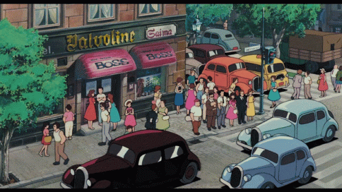 a picture of cars and people in the street outside of a restaurant