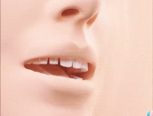 a man's mouth is open, making it appear to be smiling