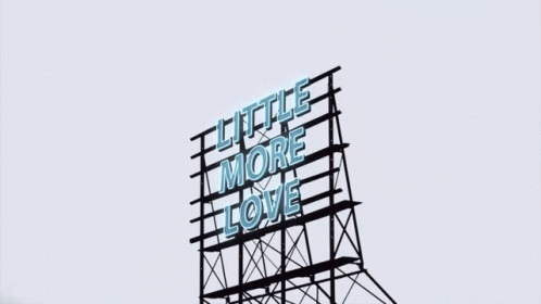 a tall advertit that says little more love